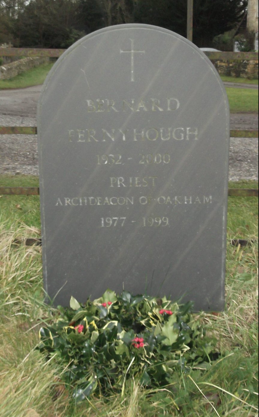 Slate headstone reading Bernard Fernyhough, 1932-2000, Priest, Archdeacon of Oakham 1977-1999